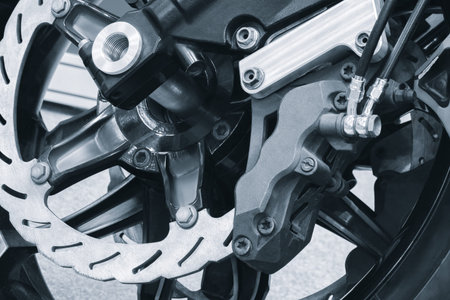 Motorcycle disc brake system as industrial transport backgroundの写真素材