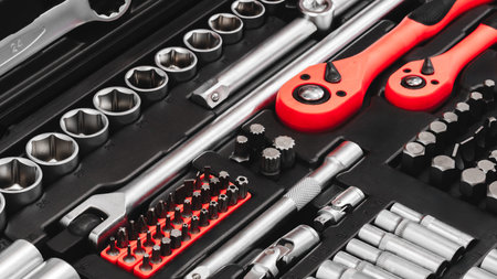 A toolbox with many different tools including pliers, wrenches, and screwdrivers. tools are...