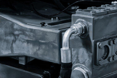 Hydraulic power drive hoses of high pressure machine, industrial power concept background.