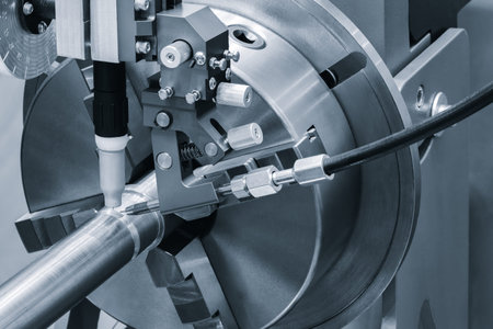 Close-up of modern industrial welding machine with fixed pipe with weld seam, industrial concept...