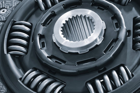Car clutch disc with abrasive linings and springs in blue tone, auto service concept background