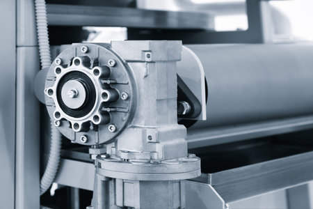 Electric drive belt conveyor close-up for food or pharmaceutical production and packaging,...