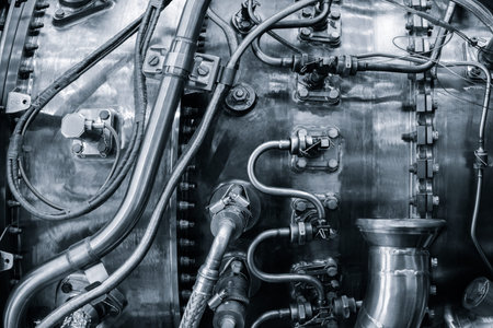 Close-up Open for service aircraft engine with many tubes of wires for valve switches and automation