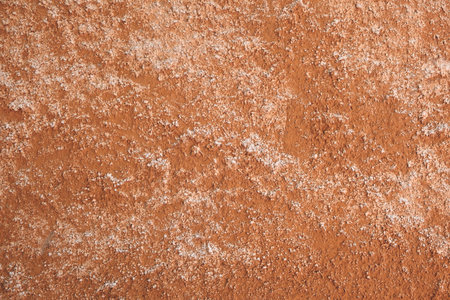 Rough full frame textured stucco in bright terracotta color. High resolution texture of plaster for...