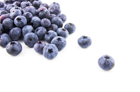 Bunch of fresh blueberries isolated on white backgroundの写真素材