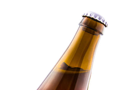 Beer bottle closeup isolated on white backgroundの写真素材