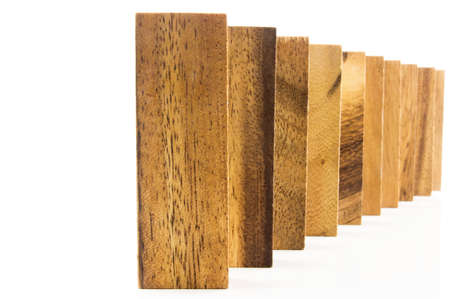 Wooden blocks arranged in a row isolated on white backgroundの写真素材