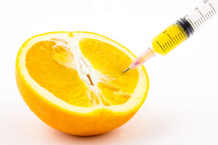 Obtaining orange juice concept isolated on white backgroundの写真素材