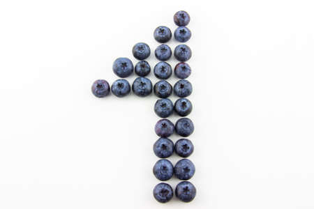 Number one concept made of fresh blueberries isolated on white backgroundの写真素材