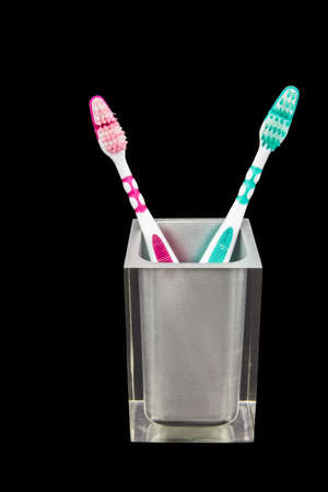 Two tooth brushes in a semi transparent containerの写真素材