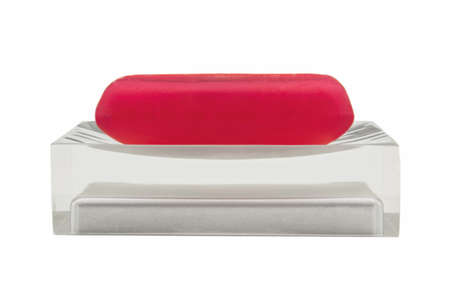 Classic red soap on a semi transparent soap dishの写真素材