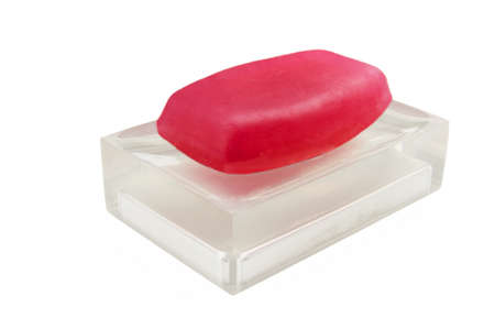 Classic red soap on a semi transparent soap dishの写真素材