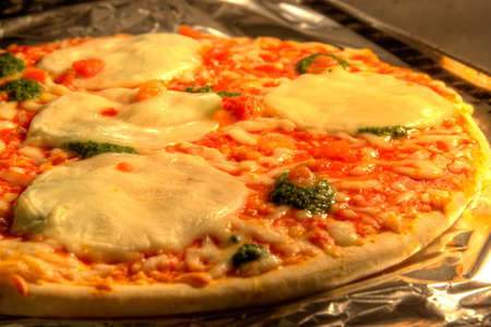 Mozzarella and spinach pizzaの写真素材