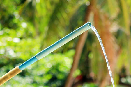 Water flowing from a primitive beach showerの写真素材