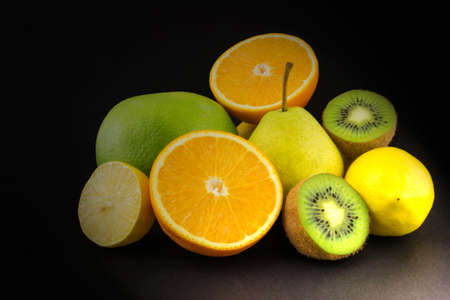 Juicy fruits isolated on black backgroundの写真素材