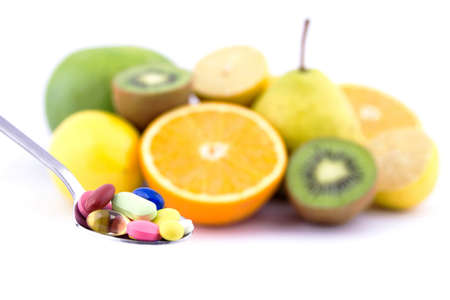 Spoon full of colorful pillsの写真素材