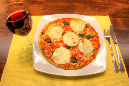 Mozzarella and spinach pizzaの写真素材