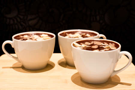 Chocolate mousse with almond in a white cupの写真素材