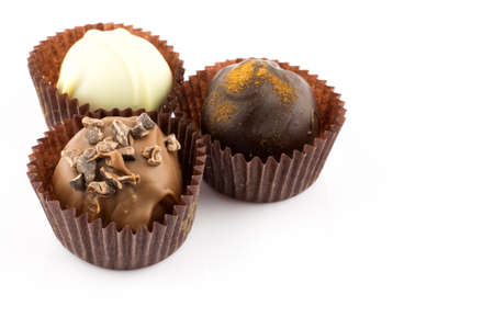 Chocolate pralines with almond, cinnamon and champagne liqueur isolated on white backgroundの写真素材