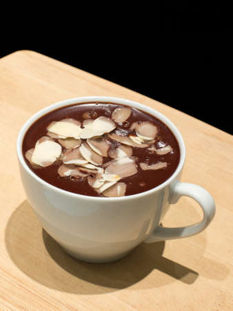 Chocolate mousse with almond in a white cupの写真素材