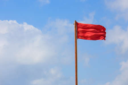 Red flag warning for swimmers on mexican beach in Playa del Carmenの写真素材