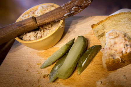 Traditional polish lard on a slice of bread and pickled cucumbersの写真素材