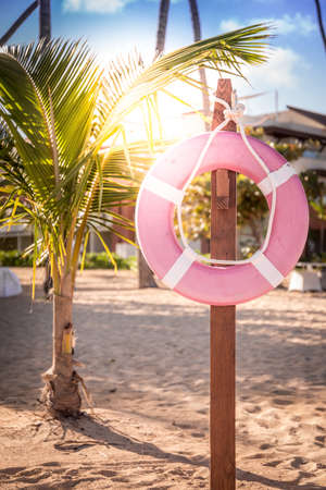 Life belt on caribbean beach in Dominican Republicの写真素材