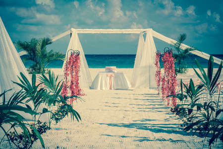 Beautiful vintage wedding altar on caribbean beachの写真素材
