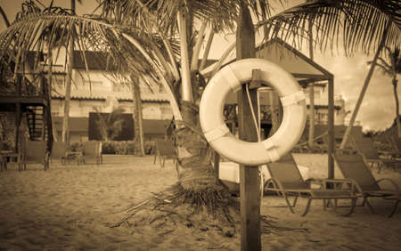 Retro style photo of life belt on caribbean beach in Dominican Republicの写真素材