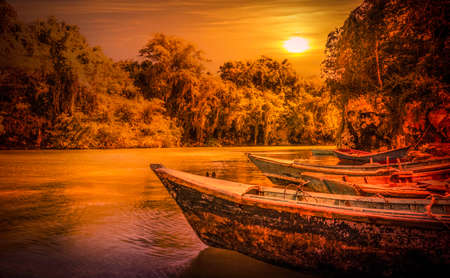 Sunset over caribbean wooden boats somewhere in Dominican Republicの写真素材