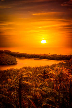 Gold caribbean sunset over mexican Contoy islandの写真素材