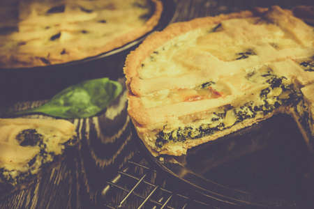 Retro style photo of tasty spinach tartの写真素材