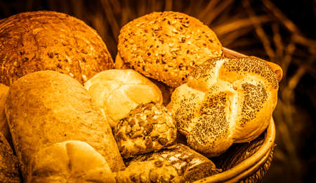 Assortment of golden loafs of bread and bread rollsの写真素材