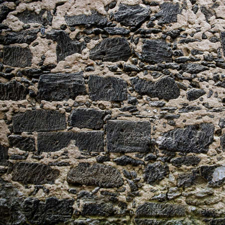 Closeup of old medieval fortification wall for backgroundの写真素材