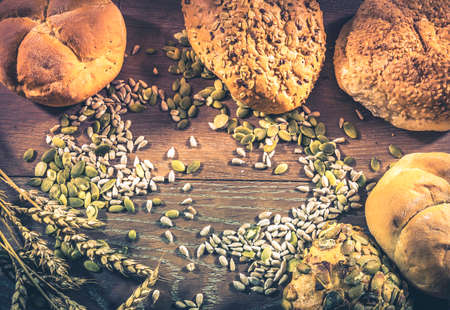 Retro style photo of assortment of loafs of bread and bread rollsの写真素材