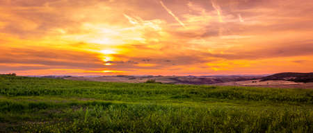 Amazing sunset and dramatic sky in Tuscany, Italyの写真素材