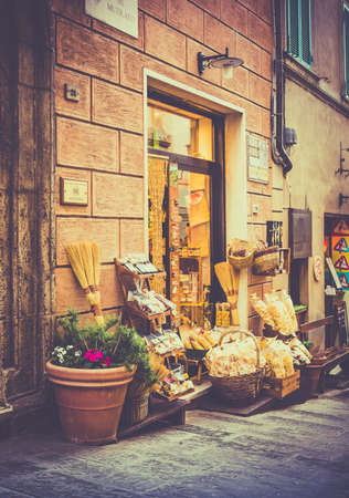 MONTEPULCIANO, ITALY - JUNE 25, 2015: typical tuscan shop with pasta and olive in antique Montepulciano city, Italyのeditorial素材