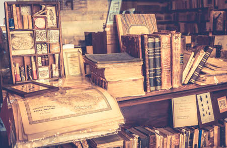 MONTEPULCIANO, ITALY - JUNE 23, 2015: collection of antique books and maps in tuscan antiquarian bookshop in Montepulciano town, Italyのeditorial素材