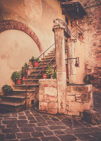 Antique well in beautiful small San Quirico Dorcia town, Tuscanyの写真素材