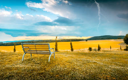 Tranquil scene before a storm with a thunder over horizonの写真素材