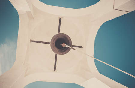 White bell tower and blue sky in the backgroundの写真素材