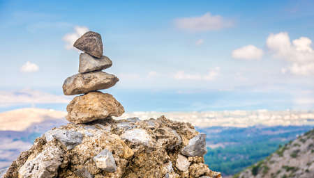Tower of pebbles and panorama of greek Kos islandの写真素材