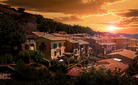Golden sunset over tuscan Costona town, Italyの写真素材