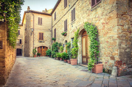 Beautiful narrow street of old Pienza town in Tuscanyの写真素材