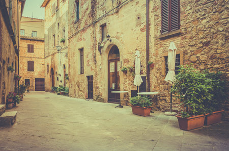 Beautiful narrow street of old Pienza town in Tuscanyの写真素材