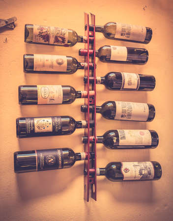 MONTEPULCIANO, ITALY - JUNE 25, 2015: Selection of italian wines in Tuscan restaurant in Montepulciano, Italyのeditorial素材