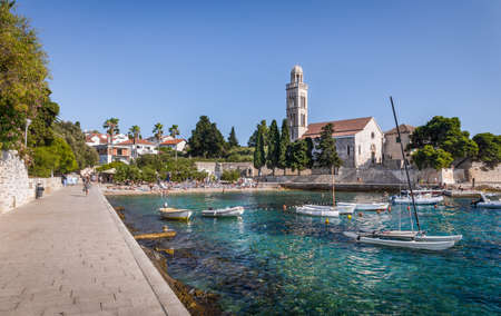 HVAR, CROATIA - JULY 30, 2016: People relaxing on a beach in Hvar village on Croatian Hvar islandのeditorial素材