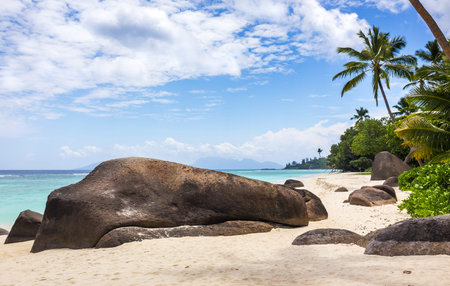 Paradise island in the Seychelles, sandy beach and blue sky over Indian Oceanの写真素材