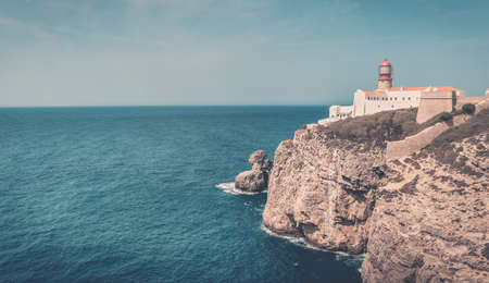 Amazing lighthouse on rocky seashore at Cape St. Vincent, Portugalの写真素材