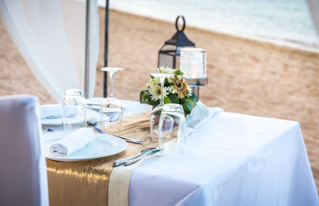 Romantic table setting in the evening on Bali island, Indonesiaの写真素材